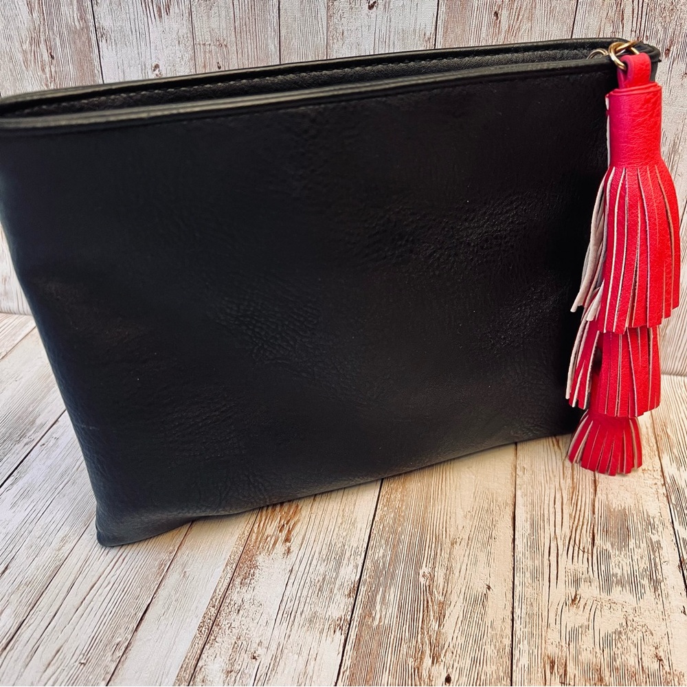 Black zip clutch w/ pink tassel NWOT